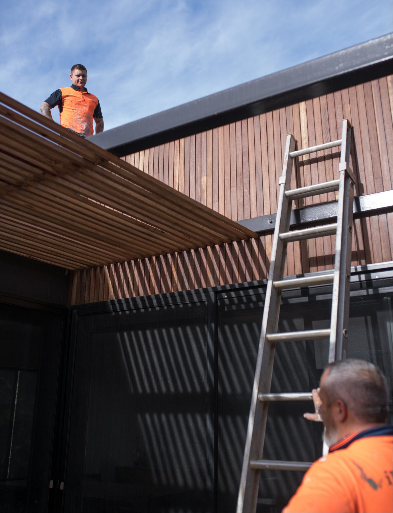 Hearth & Hammer crew working on a timber-clad outdoor build