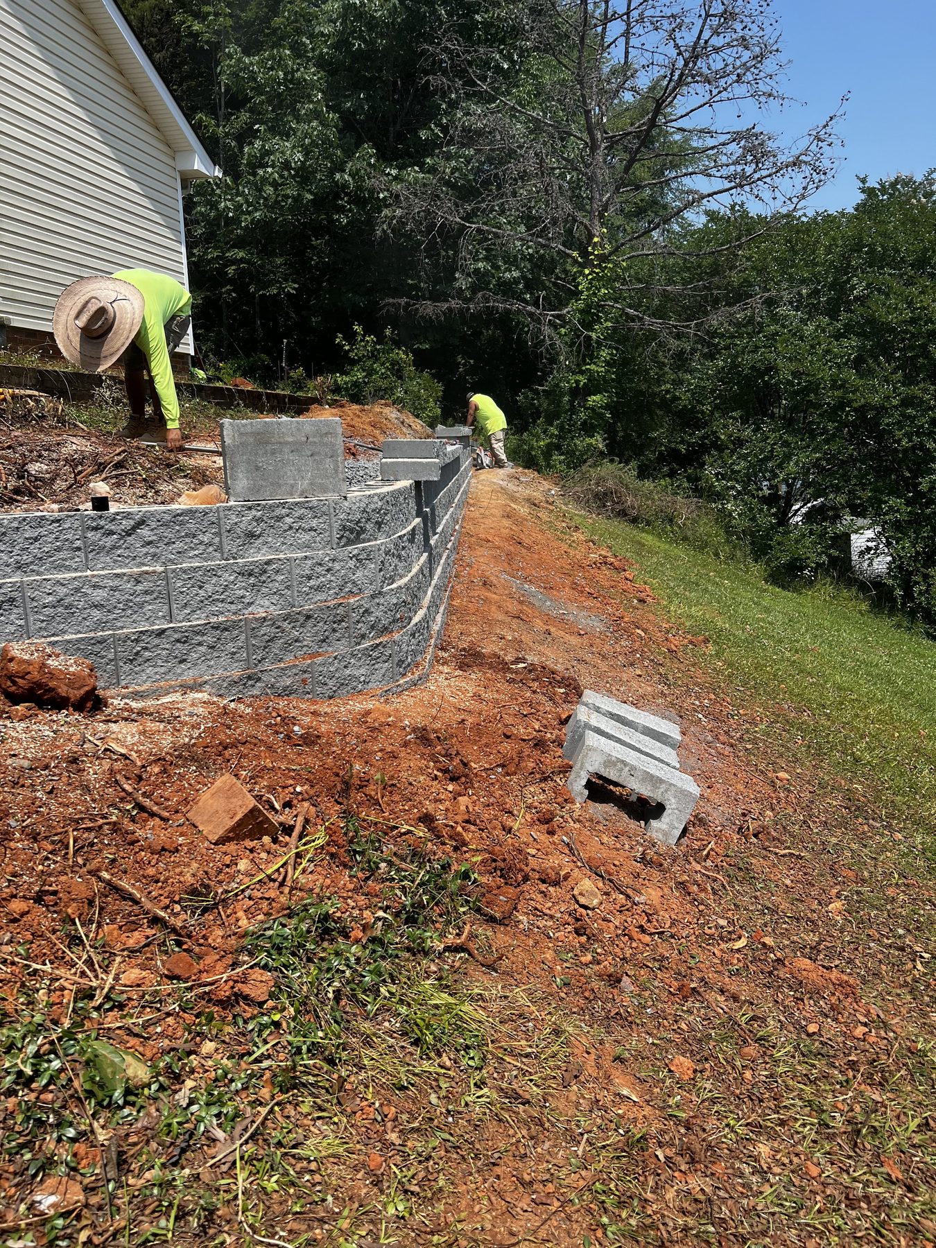 Segmental block retaining wall under construction